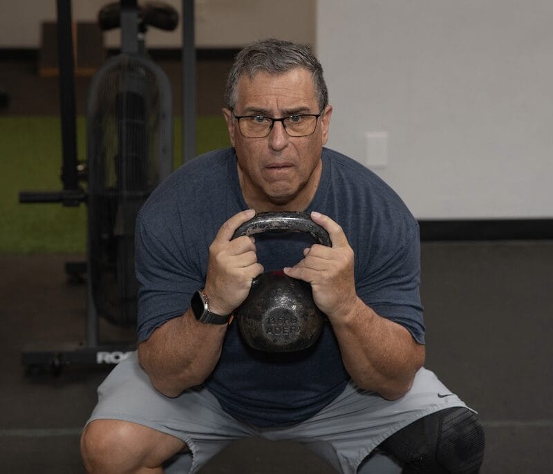 Personal training in Tucson A personal training member at Telos Strength & Conditioning in Tucson building muscle and bone health.