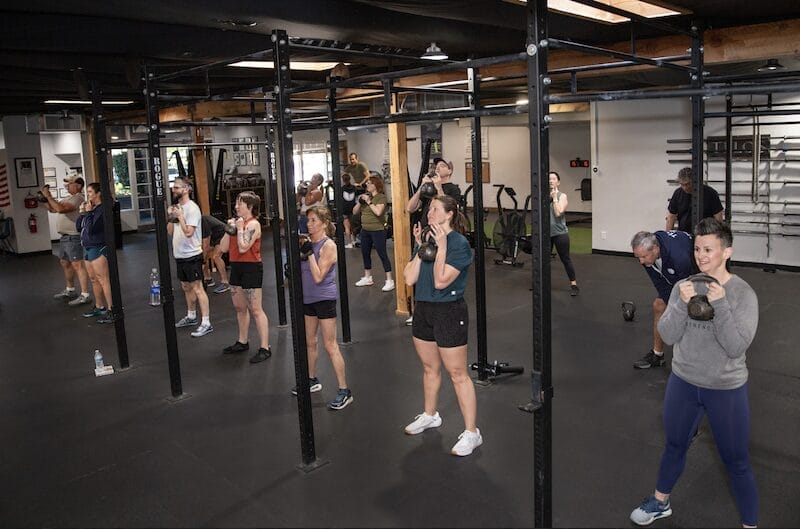 Athlete performing lighter strength training during deload week for recovery